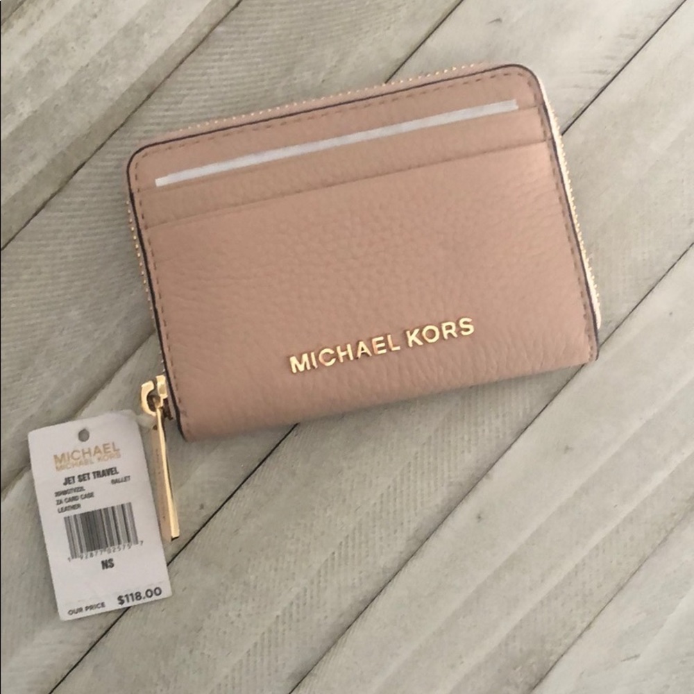 Pink Michael Kors zip around wallet